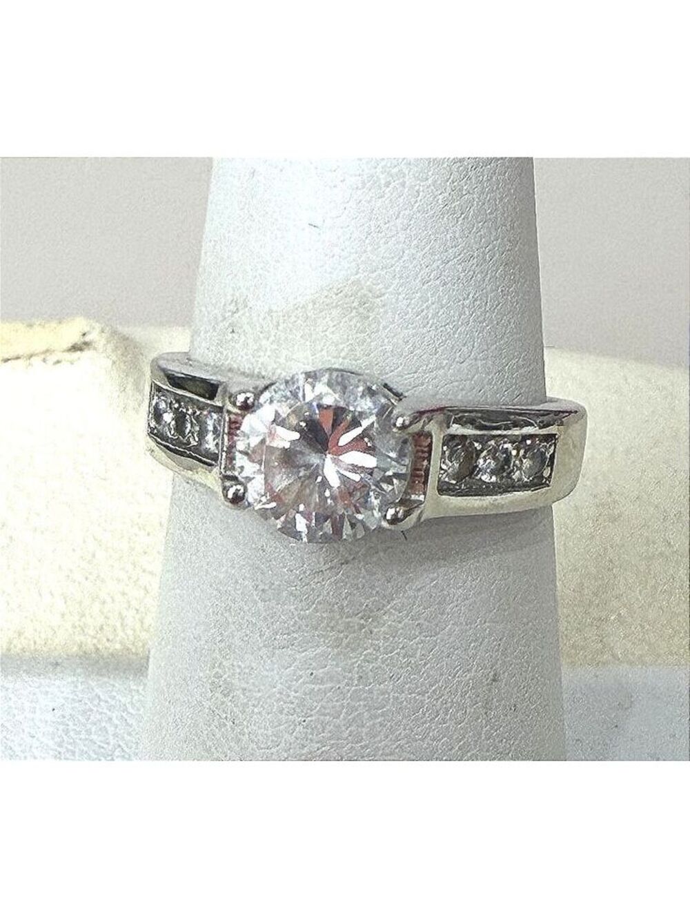 Silver Tone Ring with Clear Round Center Stone and Side Accents Size 6.5